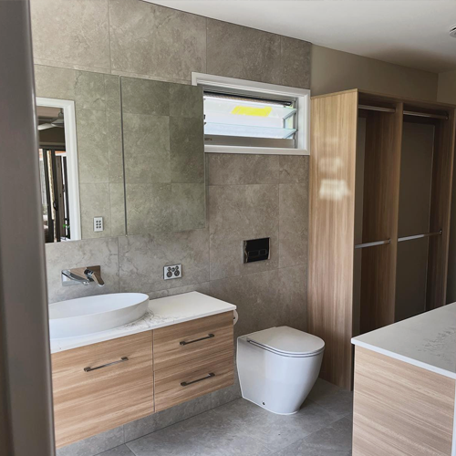Warana Warana Master Ensuite Renovation | TrembuiltEnsuite Renovation | Trembuilt Master ensuite bathroom renovation in Warana by Trembuilt with neutral finishes and wood-look cabinetry